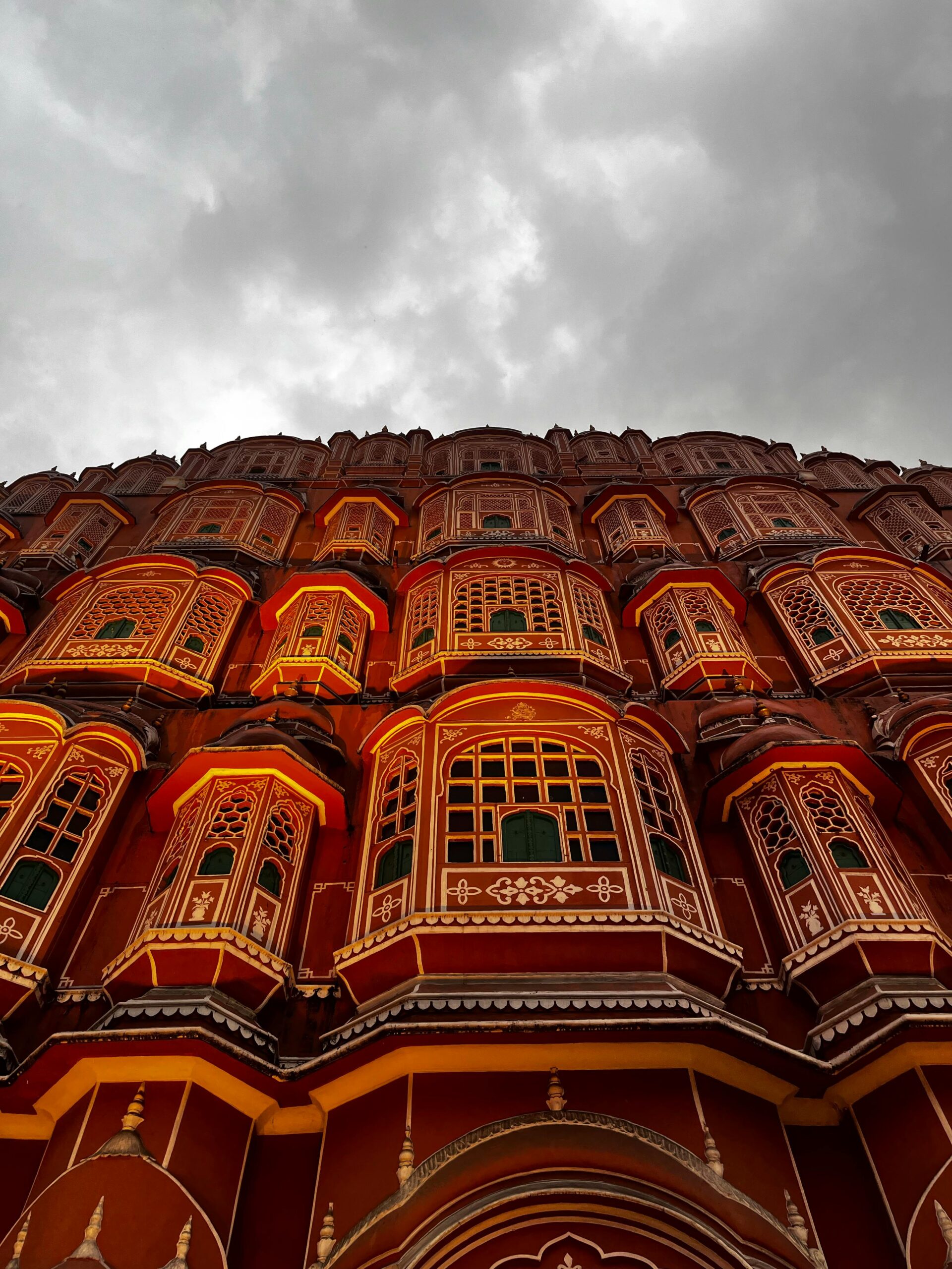 Stunning architectural marvel of Hawa Mahal against a moody sky in Jaipur, Rajasthan.